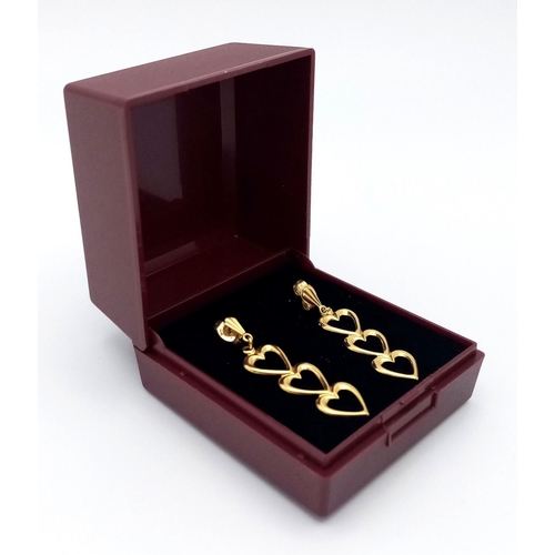 182 - Stunning pair of  9 carat GOLD EARRINGS . Drop style in the form of three hearts. Complete with GOLD... 