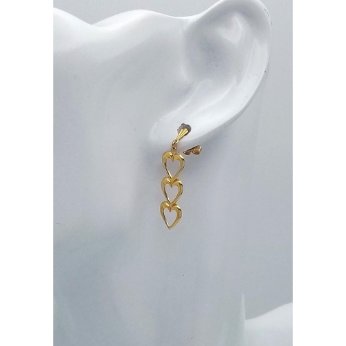 182 - Stunning pair of  9 carat GOLD EARRINGS . Drop style in the form of three hearts. Complete with GOLD... 