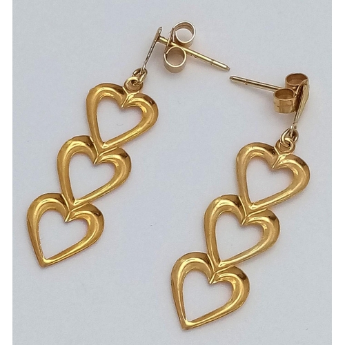 182 - Stunning pair of  9 carat GOLD EARRINGS . Drop style in the form of three hearts. Complete with GOLD... 