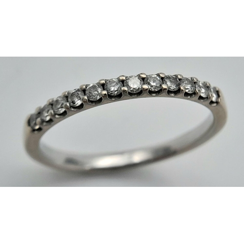 211 - An 18K White Gold and Diamond Half Eternity Ring. Size P. 2.4g total weight. Ref: 017640