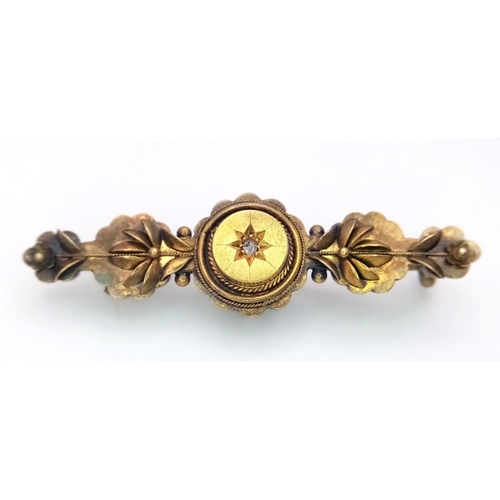 248 - A 15K GOLD ANTIQUE BROOCH WITH CENTRAL DIAMOND .  2.3gms    3.5cms