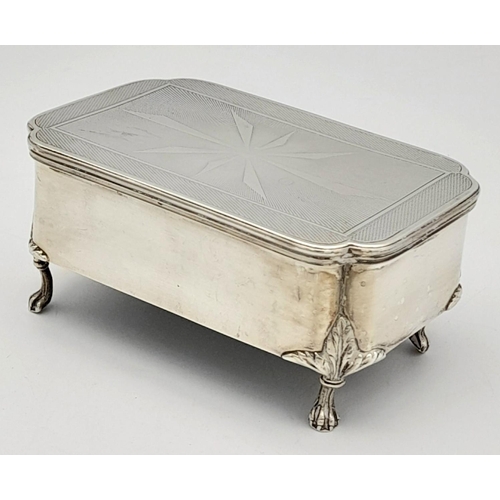 262 - A SOLID SILVER FOOTED TRINKET BOX WITH DECORATED LID AND VELVET LINING CIRCA 1930 .   263.2gms     1... 