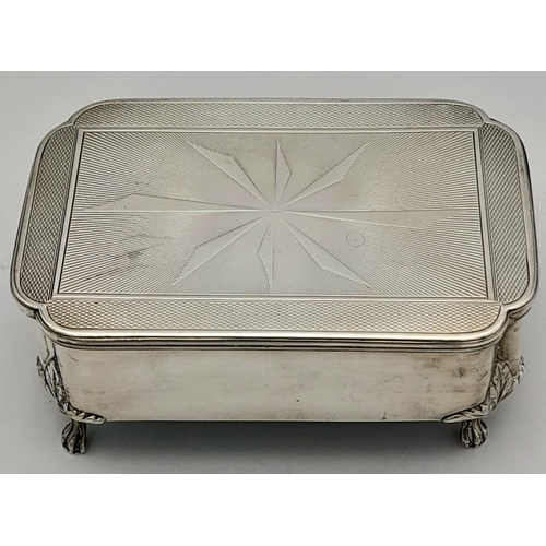 262 - A SOLID SILVER FOOTED TRINKET BOX WITH DECORATED LID AND VELVET LINING CIRCA 1930 .   263.2gms     1... 