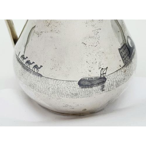 269 - AN EGYPTIAN SILVER JUG WITH ENGRAVEED NILE SCENE .  150gms     11cms TALL