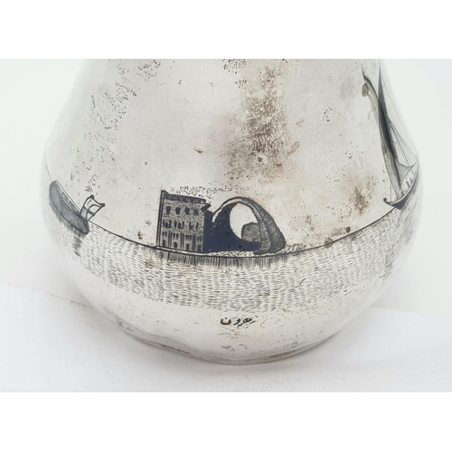 269 - AN EGYPTIAN SILVER JUG WITH ENGRAVEED NILE SCENE .  150gms     11cms TALL