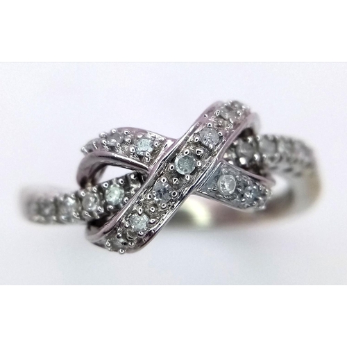 270 - A 9K WHITE GOLD DIAMOND SET BOW CROSSOVER RING 2.8G , SIZE P.

ref: 4957