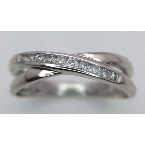 277 - A 9K WHITE GOLD DIAMOND SPLIT CROSSOVER BAND RING 0.15CT , 2.2G , SIZE N.

ref: 5176