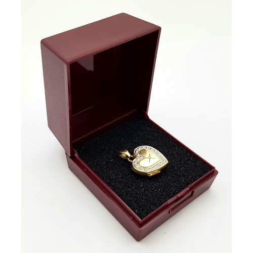 280 - Vintage 9 carat YELLOW and WHITE GOLD LOCKET with centre DIAMOND DETAIL.1 gram. 2.1 cm drop.