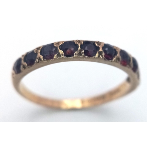 315 - Interesting Vintage RING having 10 GARNETS mounted and set in a 9 carat GOLD BAND. 2.0 grams. Size T... 