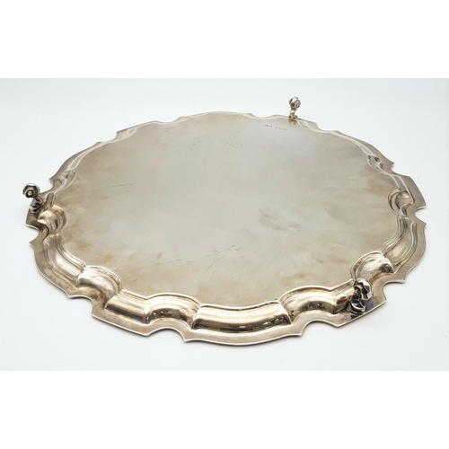 344 - A SOLID SILVER FOOTED PLATTER AWARDED TO A PROMINENT SURGEON ON HIS RETIREMENT IN 2002 .   728.5gms ... 