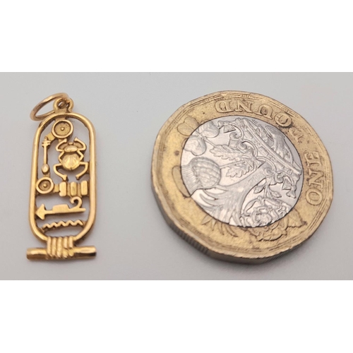 355 - A 18K Yellow Gold Symbols Pendant, 1.6g total weight , 22mm x 9mm.

ref: 1560I