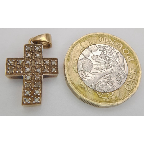 357 - 9 carat GOLD CROSS PENDANT , CLUSTER SET with DIAMONDS. 3 grams. 2.5 cm x 1.5 cm.