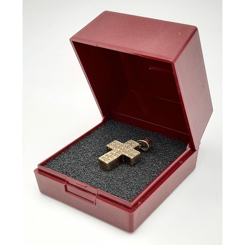 357 - 9 carat GOLD CROSS PENDANT , CLUSTER SET with DIAMONDS. 3 grams. 2.5 cm x 1.5 cm.