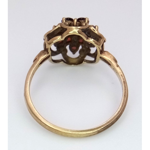 364 - Hallmarked 9 carat GOLD,GARNET CLUSTER RING. Complete with ring box.2.1 grams. Size K.