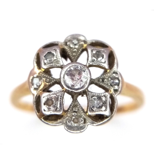 396 - A 9K Yellow Gold (Tested As) Diamond Flower Ring, 0.09ct diamond, 2.3g total weight, size K 1/2. 

r... 