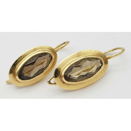 455 - Beautiful pair of 14 carat GOLD,and BROWN AMETHYST EARRINGS. Oval cut in Marquise style. 2.6 grams.