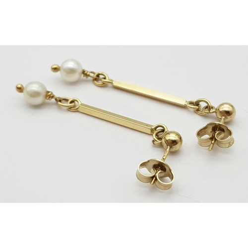 546 - Classic 9 carat GOLD and PEARL EARRINGS. Having GOLD BATONS with PEARL detail in drop style. Complet... 