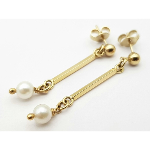 546 - Classic 9 carat GOLD and PEARL EARRINGS. Having GOLD BATONS with PEARL detail in drop style. Complet... 