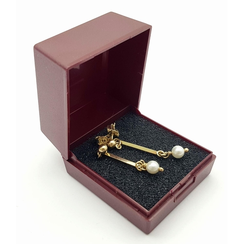 546 - Classic 9 carat GOLD and PEARL EARRINGS. Having GOLD BATONS with PEARL detail in drop style. Complet... 