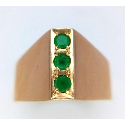 60 - A 18K (tested as) Yellow Gold Emerald Three Stone Ring, 0.12ct Emerald, 7.1g total weight, size T.

... 