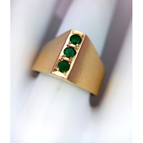 60 - A 18K (tested as) Yellow Gold Emerald Three Stone Ring, 0.12ct Emerald, 7.1g total weight, size T.

... 