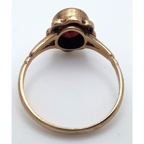 70 - Vintage 9 carat GOLD RING with large (1 carat) Oval Cut GARNET mounted to top. Complete with ring bo... 