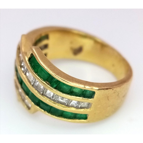 85 - An 18K Yellow Gold Emerald and Diamond Swirl Ring. 0.6ctw emeralds, 0.5ctw diamonds approx. Size K. ... 