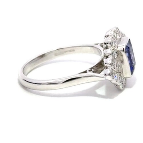 93 - 18ct white gold TANZANITE and DIAMOND ring, 1.09ct emerald cut Tanzanite centre stone surrounded by ... 