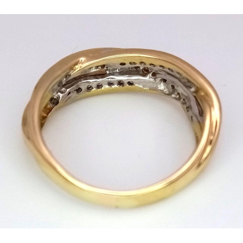 107 - A 18K YELLOW GOLD DIAMOND CROSSOVER RING 0.40CT 4.7G SIZE N.

ref: SC 2054