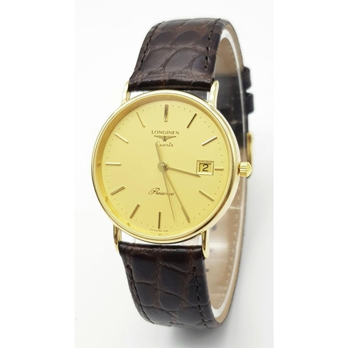 162 - A Longine 9K Yellow Gold Cased Quartz Gents Watch. Brown leather strap. 9K gold case - 32mm. Gold to... 