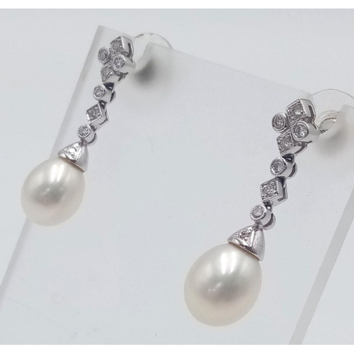 204 - A Pair of 18K White Gold, Diamond and Pearl Drop Earrings. 3cm. 6g total weight. Ref: 017609