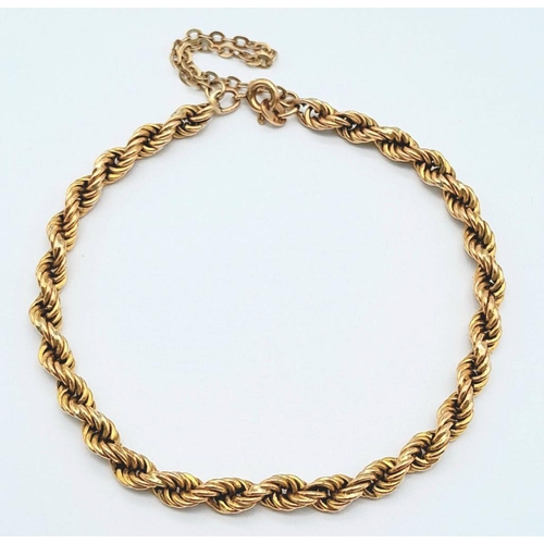 215 - A 9K Yellow Gold Rope Bracelet w/ Safety Chain, 5.4g total weight, 20cm length.

ref 1549I