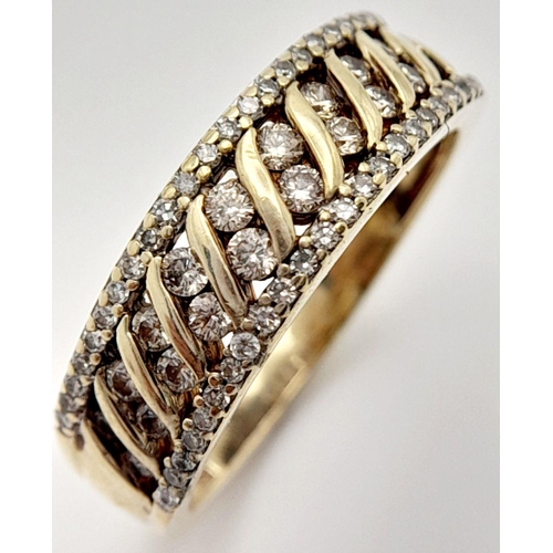 243 - A 9K YELLOW GOLD DIAMOND BAND RING 3.2G , SIZE O.

ref: SC 2006