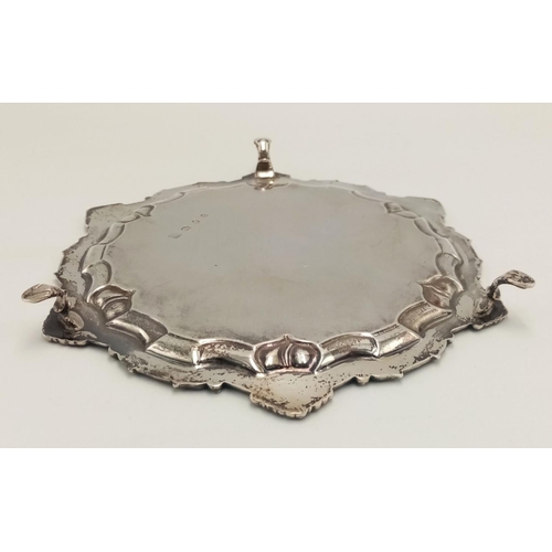 268 - A SOLID SILVER FOOTED PLATTER HALLMARKED LONDON 1932 WITH INTRICATE SCROLLED EDGING.   183.5gms    1... 