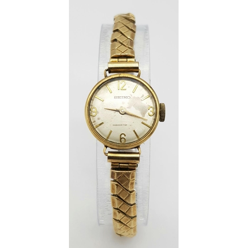 281 - A VINTAGE 9K GOLD SEIKO LADIES WATCH ON AN EXCALIBUR EXPANDING STRAP ,MANUAL MOVEMENT , WORKING BUT ... 