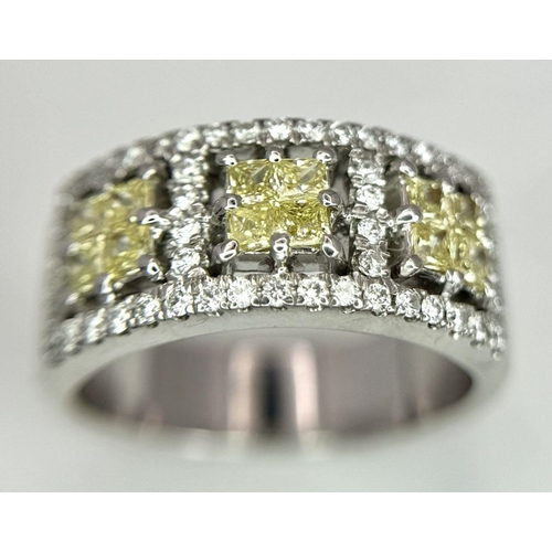 33 - A 18K WHITE GOLD VIVID YELLOW & WHITE DIAMOND RING 0.72CT OF YELOW PRINCESS CUT DIAMONDS & 0.50CT OF... 