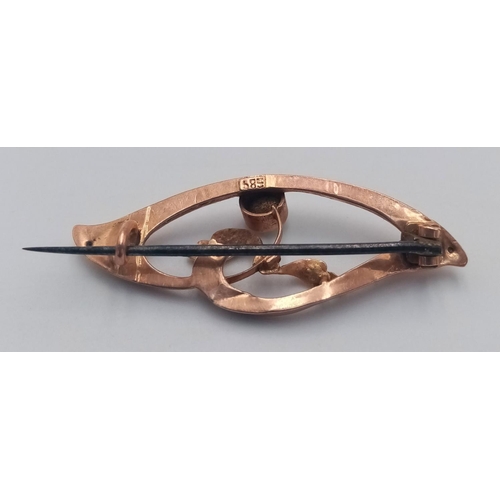 372 - AN ANTIQUE 14K ROSE GOLD  BROOCH WITH A SMALL FIRE OPEL.   1.5gms