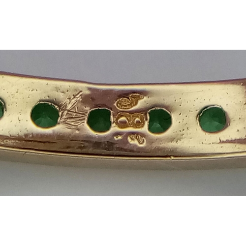 424 - A 14K YELLOW GOLD GREEN STONE SET FULL ETERNITY / BAND RING 1.3G SIZE L.

ref: SC 2058