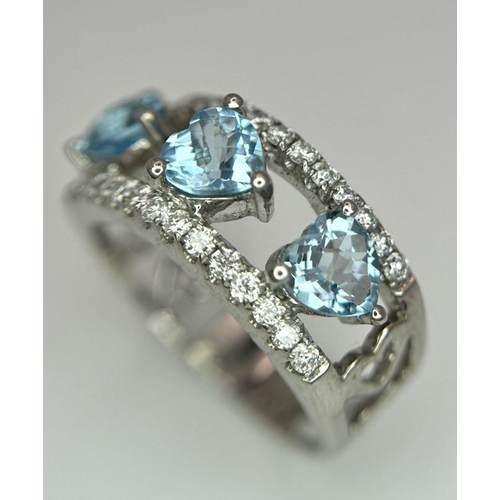 534 - A 18K WHITE GOLD DIAMOND & BLUE TOPAZ RING 0.38CT DIAMONDS & THREE HEART SHAPED TOPAZ TOTAL 1.64CT ,... 