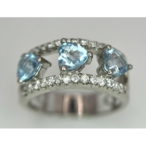 534 - A 18K WHITE GOLD DIAMOND & BLUE TOPAZ RING 0.38CT DIAMONDS & THREE HEART SHAPED TOPAZ TOTAL 1.64CT ,... 