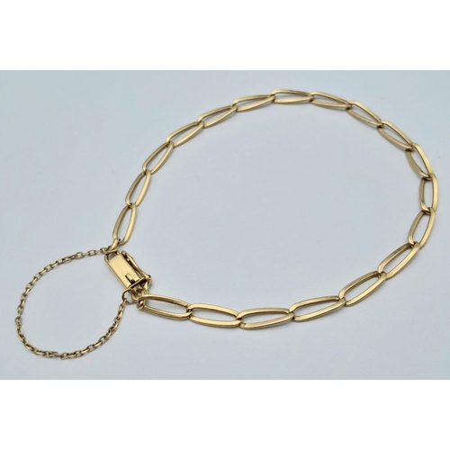 74 - A 18K (tested as) Yellow Gold Curb Bracelet with Safety Chain, 5.7g total weight, 20cm length.

ref:... 