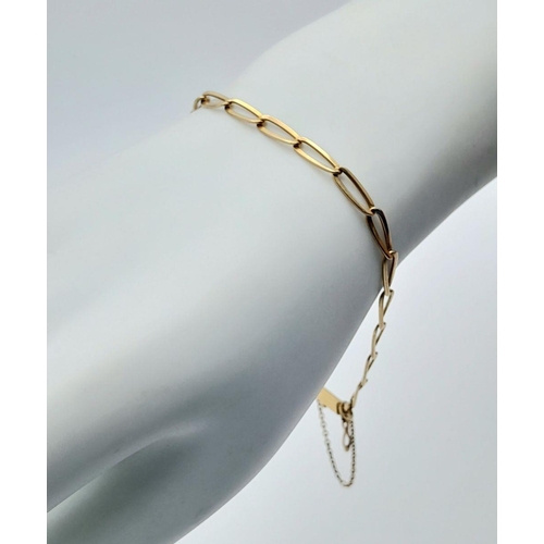 74 - A 18K (tested as) Yellow Gold Curb Bracelet with Safety Chain, 5.7g total weight, 20cm length.

ref:... 