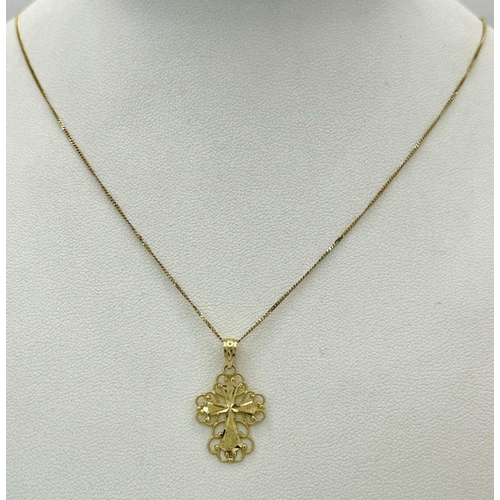 77 - Beautiful 14 CARAT GOLD CROSS with filigree surround mounted on a fine 9 carat GOLD CHAIN NECKLACE. ... 