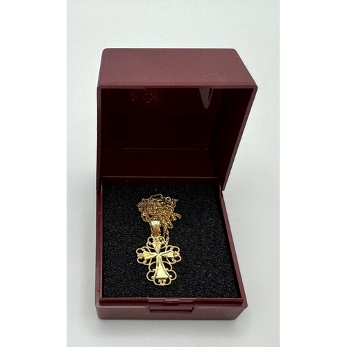 77 - Beautiful 14 CARAT GOLD CROSS with filigree surround mounted on a fine 9 carat GOLD CHAIN NECKLACE. ... 