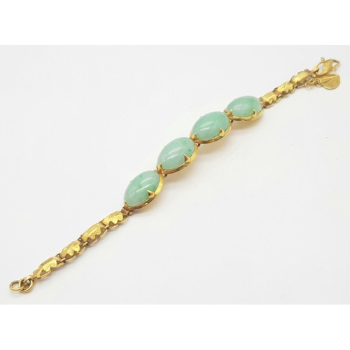 78 - A Child's 18K Yellow Gold (tested) and Jade Cabochon Bracelet. 14cm. 14g total weight.