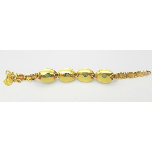 78 - A Child's 18K Yellow Gold (tested) and Jade Cabochon Bracelet. 14cm. 14g total weight.