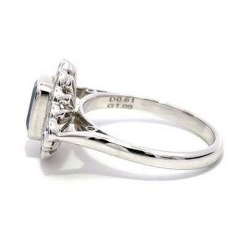 93 - 18ct white gold TANZANITE and DIAMOND ring, 1.09ct emerald cut Tanzanite centre stone surrounded by ... 