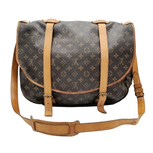 120 - A Louis Vuitton Monogram Saumur Double Strap Shoulder Bag. Brown LV monogram coated canvas exterior,... 