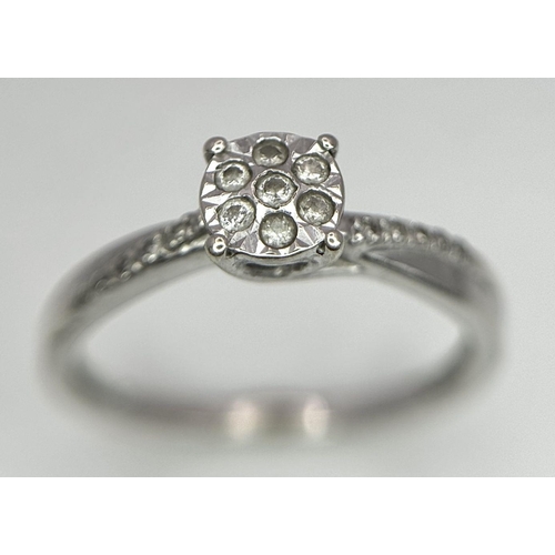 523 - A 9K WHITE GOLD DIAMOND CROSS-OVER CLUSTER RING 1.5G , SIZE K.

ref: SC 2004