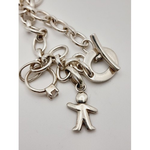 467 - A STERLING SILVER CHARM NECKLACE WITH 2 CHARMS & T BAR CLASP 35.2G, 44CM LENGTH.

ref: 8674